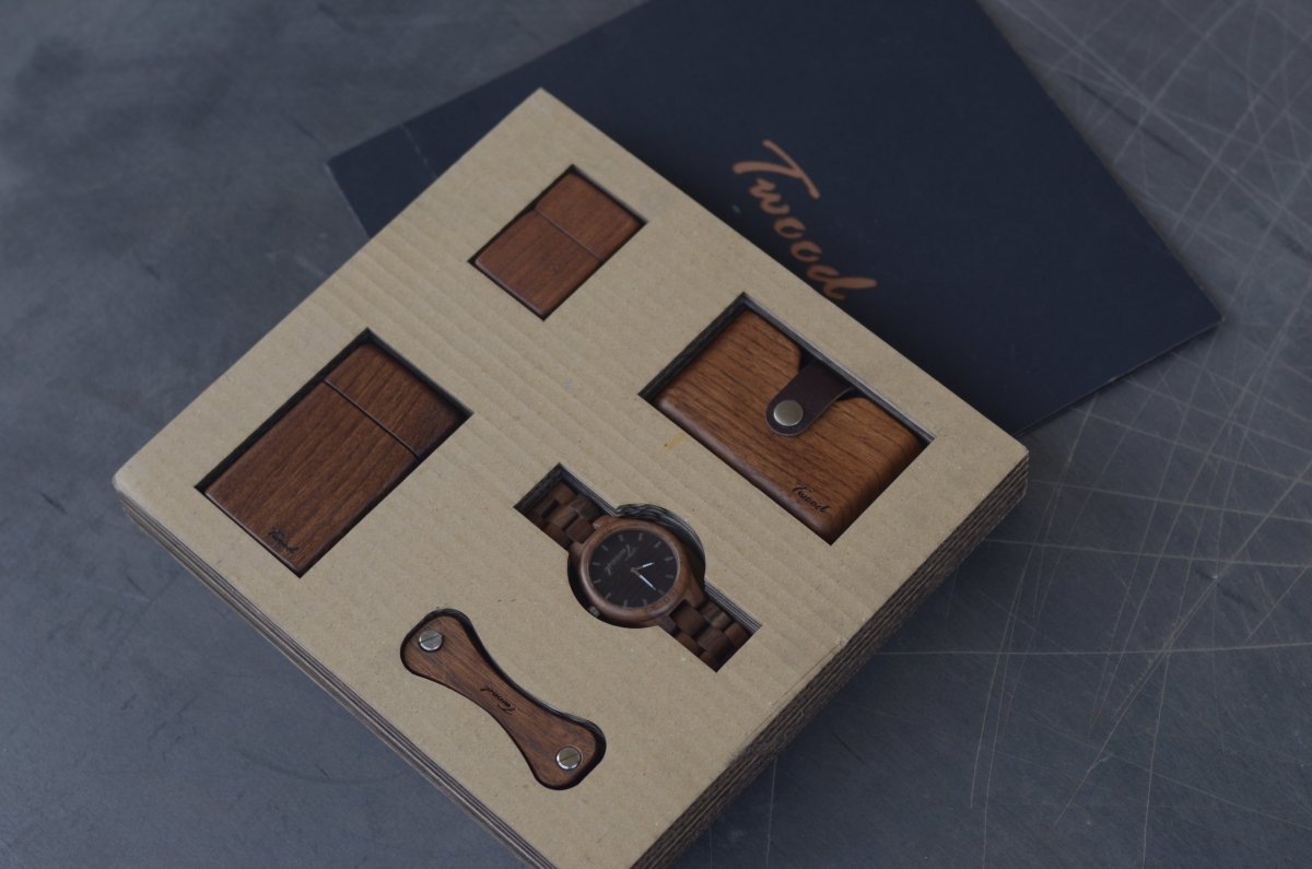 Collection of handcrafted wooden gifts including wooden watches, wallets, desk organizers and accessories displayed on natural wood background