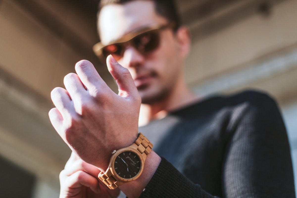 Handcrafted wooden watches for men and women displayed showing natural wood grain patterns and sustainable craftsmanship
