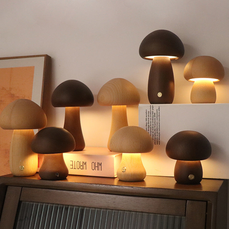 Set of mushroom-shaped lamps on a wooden surface with a neutral background