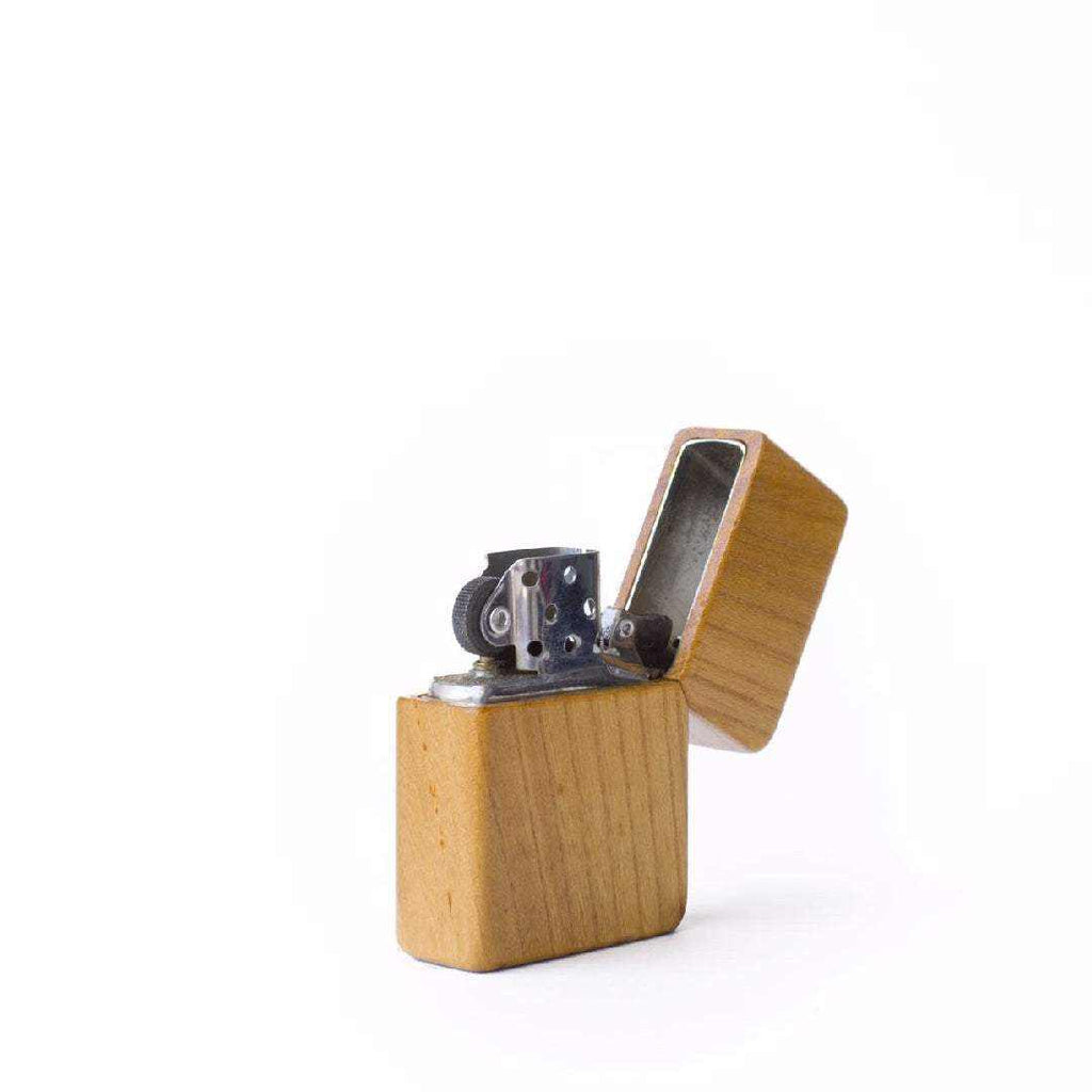 eco-friendly wooden lighter with natural wood casing and metal ignition mechanism open on white background