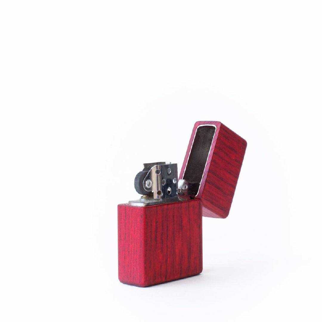 compact wooden lighter with red finish and metal ignition mechanism, ecofriendly and sustainable design
