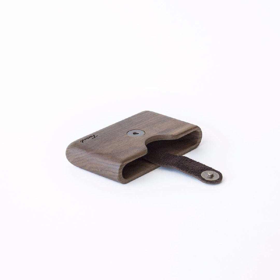 Sustainable handmade wooden wallet with card slot and leather strap closure