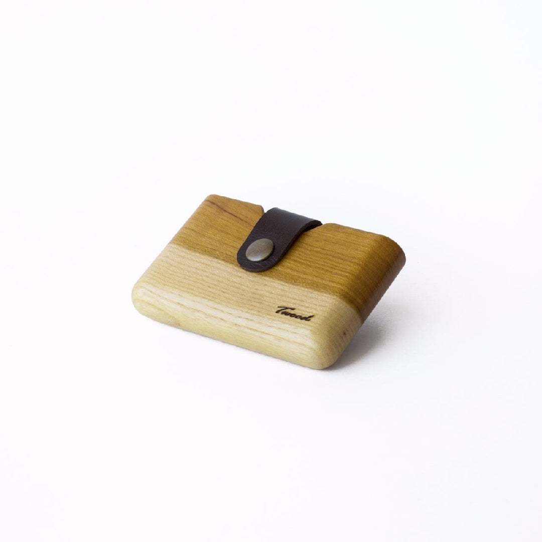Compact eco-friendly wooden wallet with leather strap and card slot, handmade from natural wood.