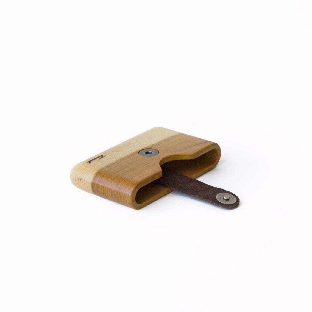 Minimalist handmade wooden wallet with card slot and leather strap, eco-friendly and sustainable design.
