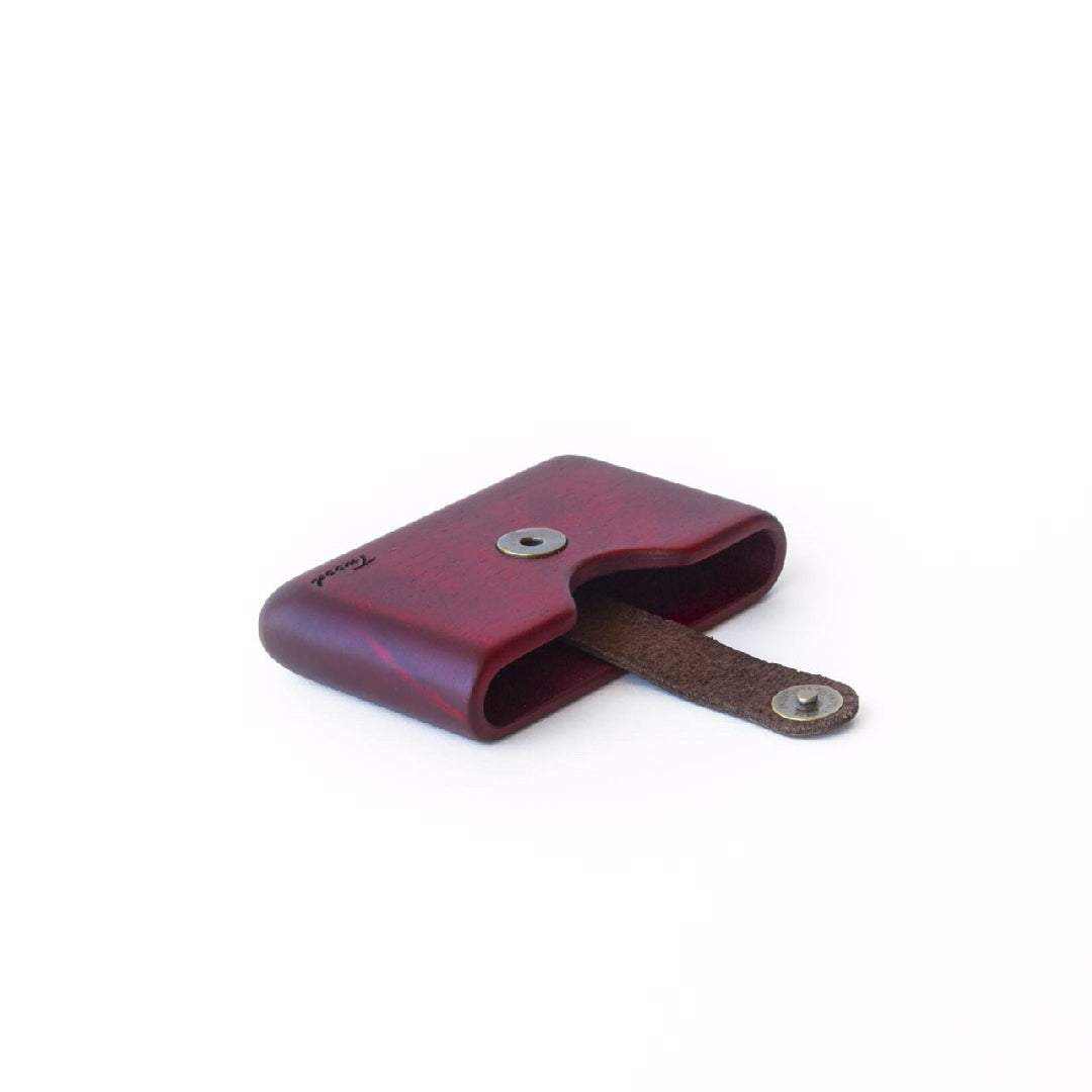 Compact eco-friendly handmade wooden wallet with secure card slot and leather strap closure