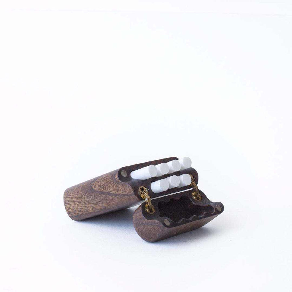 Handcrafted wooden cigarette case holding seven cigarettes in natural wood finish