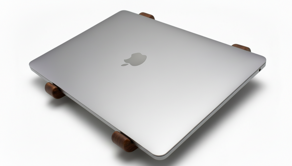 Laptop on a wooden stand with Apple logo