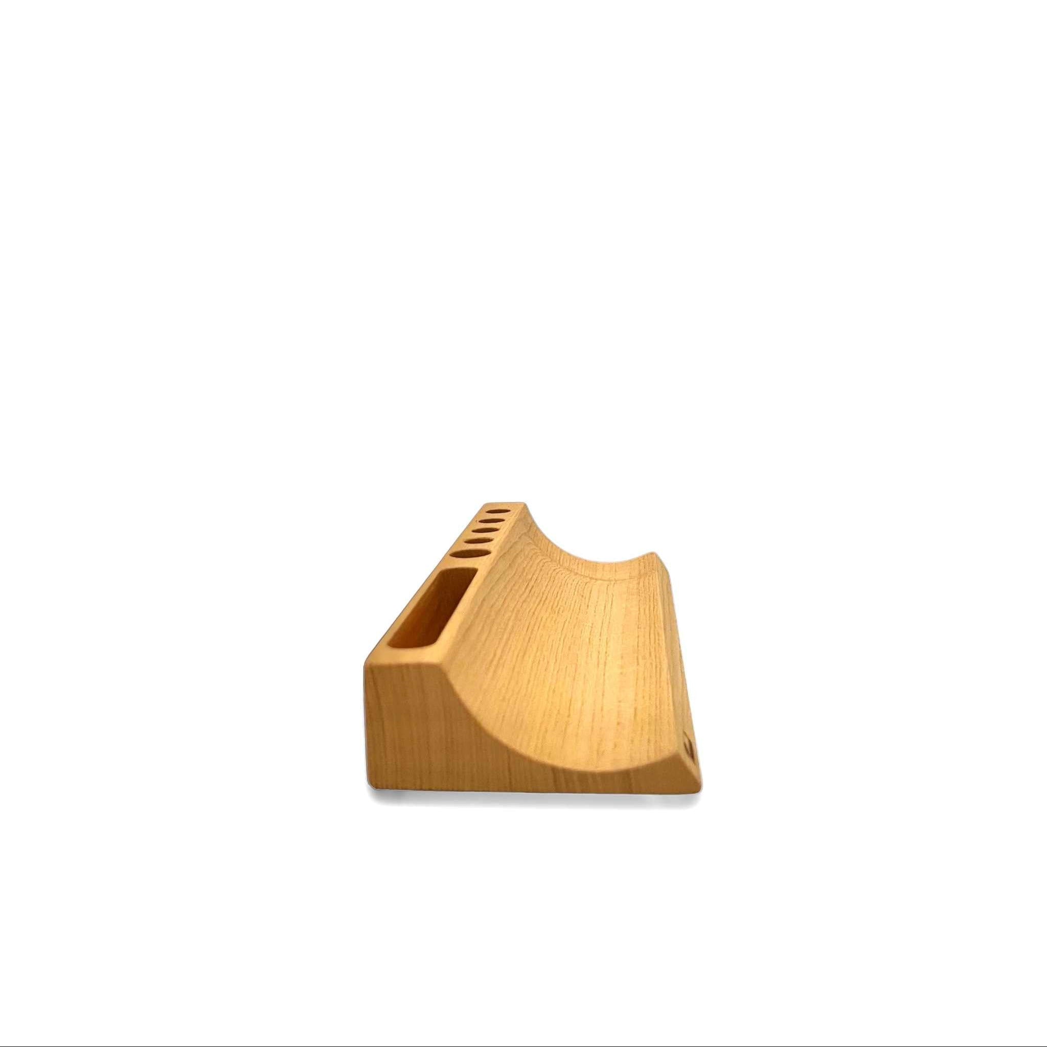 Handcrafted wood pen holder with natural grain, designed for desk organization and style